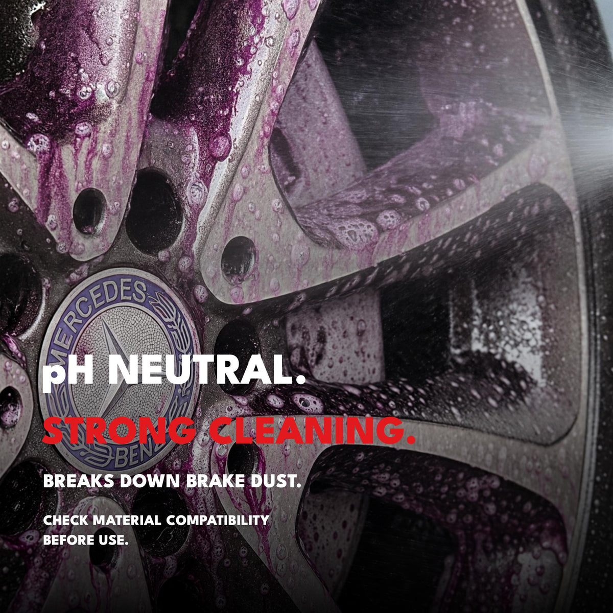 Ultra Wheel Cleaner reacting with brake dust on an alloy wheel; pH-neutral cleaner with purple reaction visible.