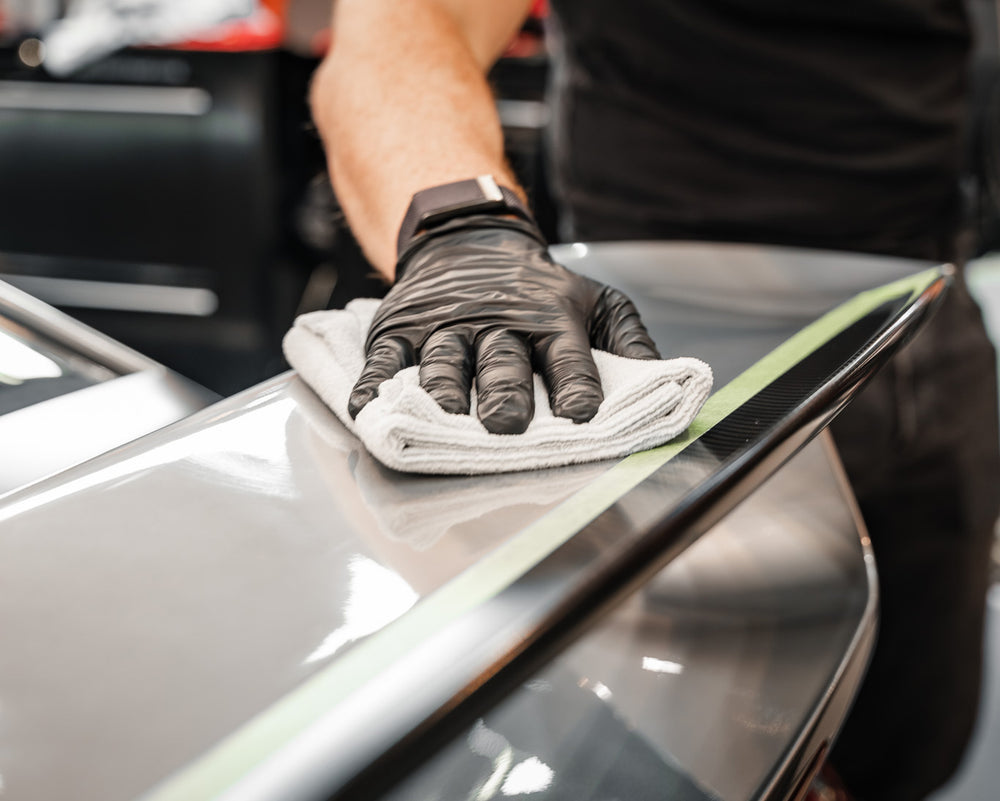 Soft grey 300 GSM microfibre cloth removing residue from paintwork